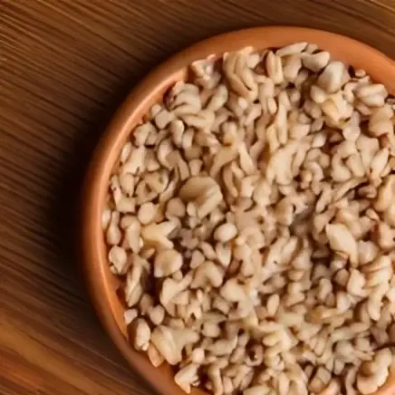 A bowl of boiled chicken and rice, a homemade cat food recipe designed to cater to the dietary needs of diabetic cats.